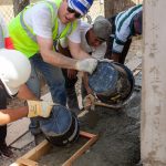 Proman's CEO David Cassidy helping Cherrylyn to build her home