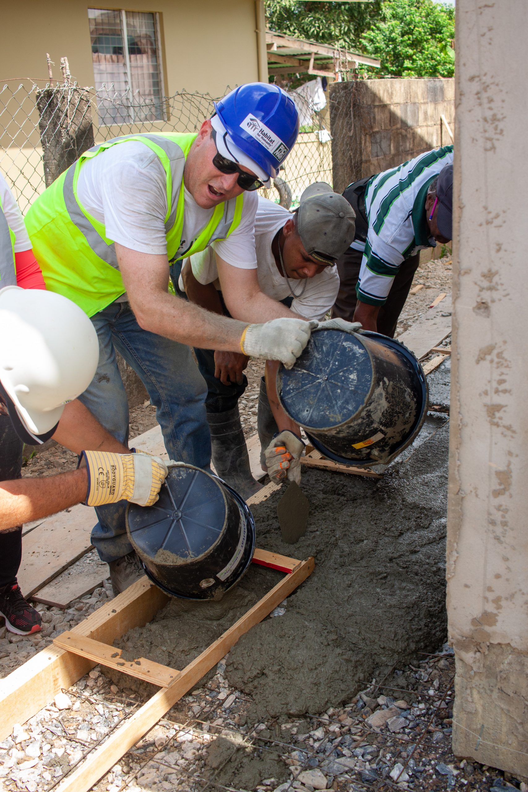 Proman's CEO David Cassidy helping Cherrylyn to build her home